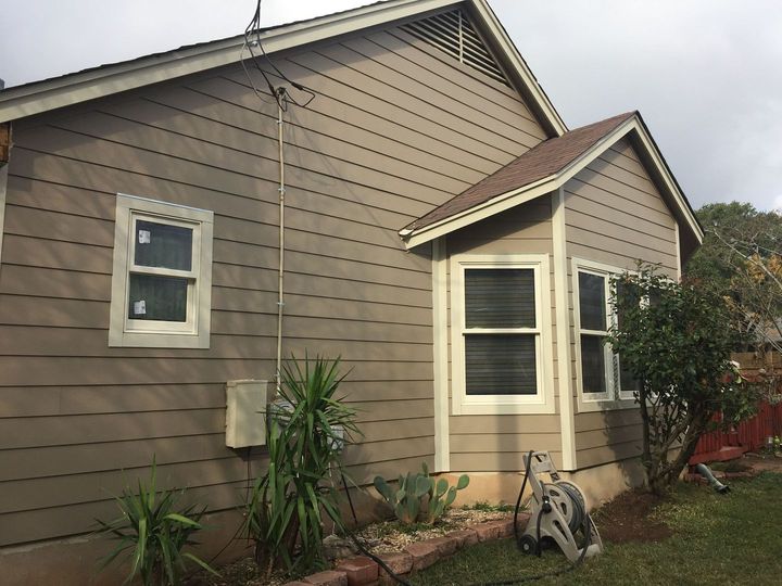 A house with a lot of windows on the side of it