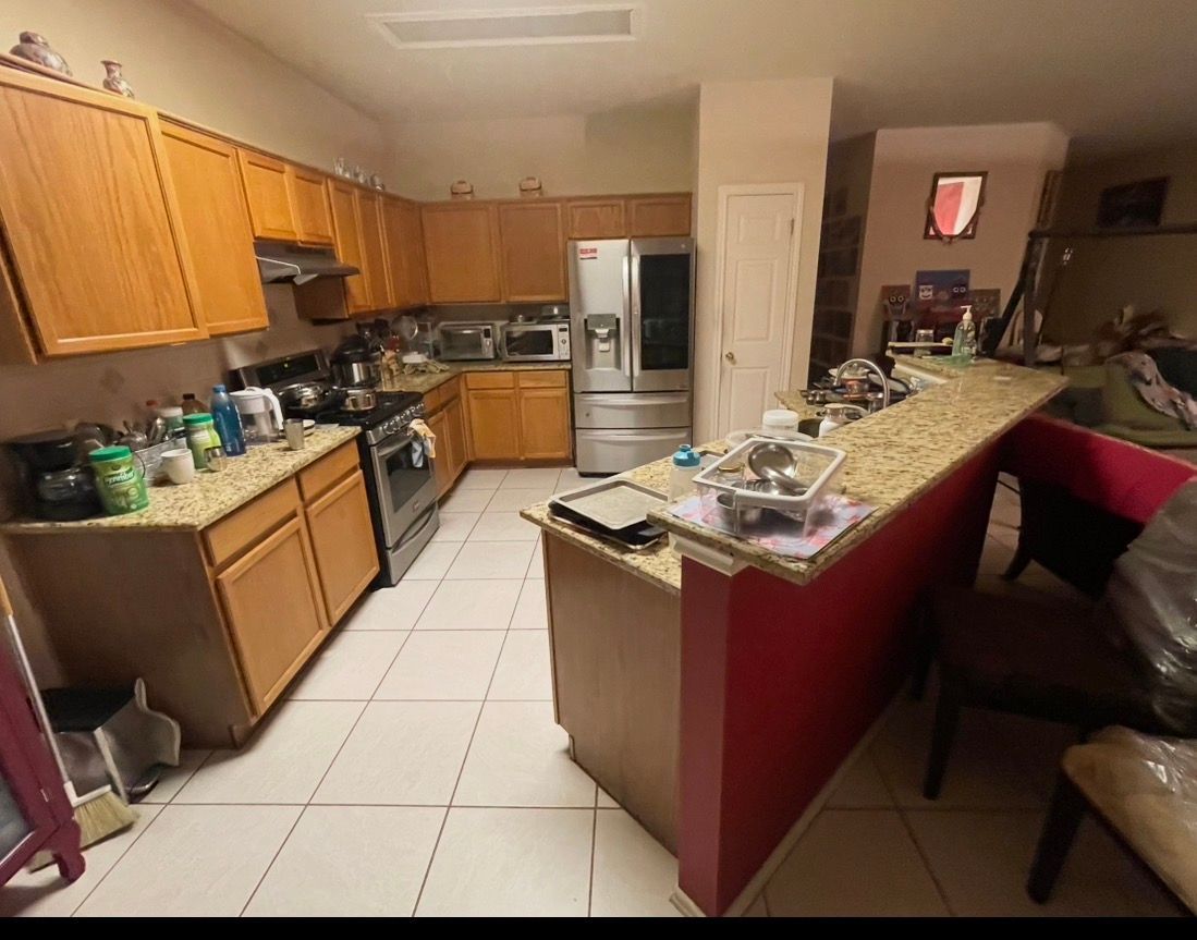 A bathroom with two sinks and a shower.
