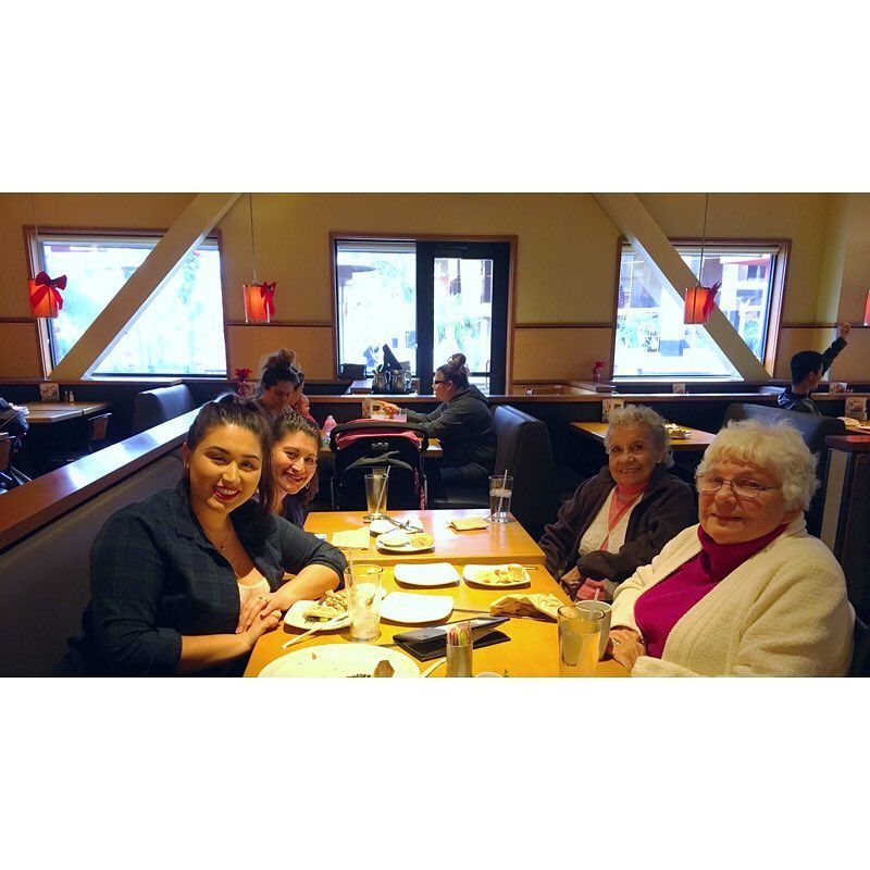 A group of women are sitting at a table in a restaurant.