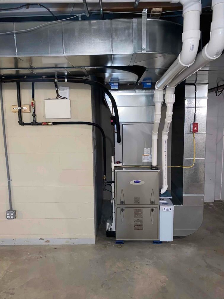 A heating and cooling system is installed in a basement.