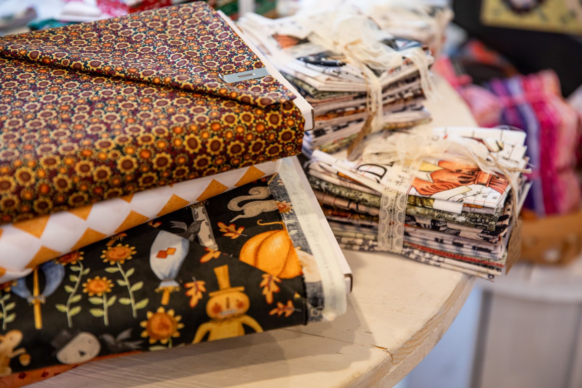 There are many different types of fabrics on the table.