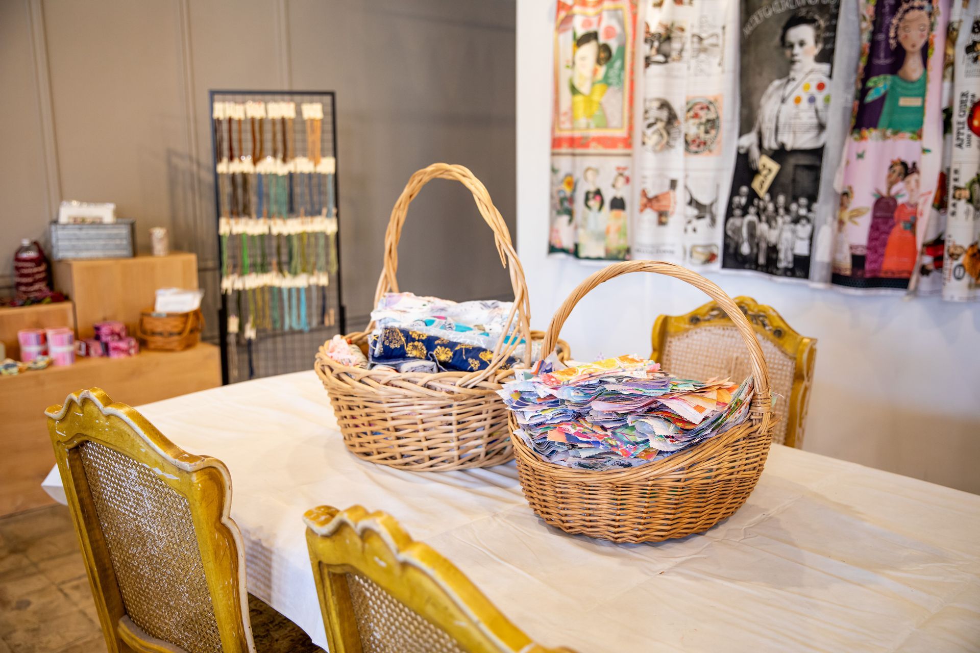 Three baskets are sitting on a table in a room.