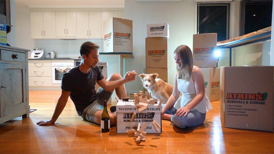 Two Person with a Dog Playing a Bricks | Launceston, Tas | Atkins Removals & Storage Pty Ltd
