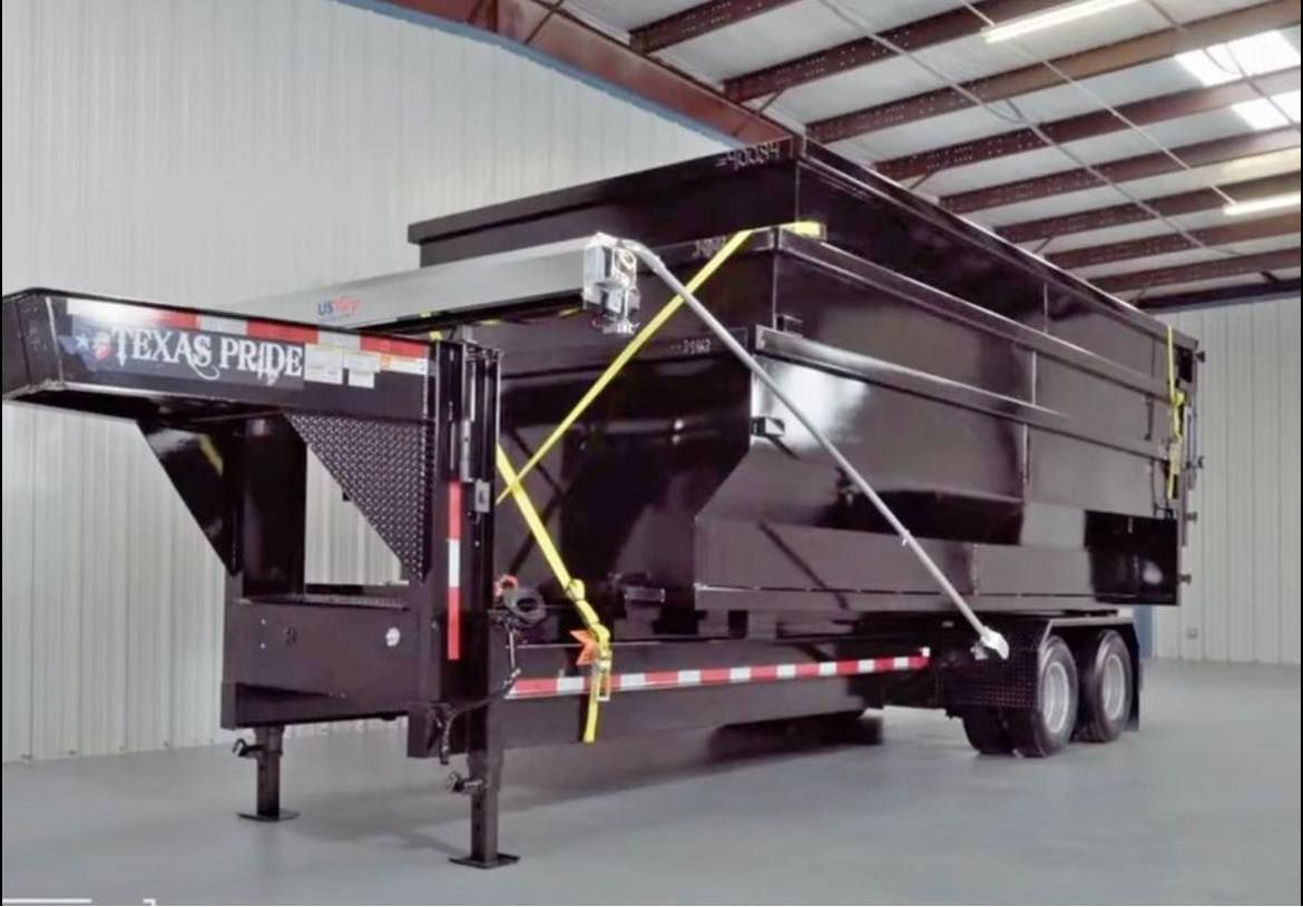 A texas pride dump trailer is sitting in a warehouse