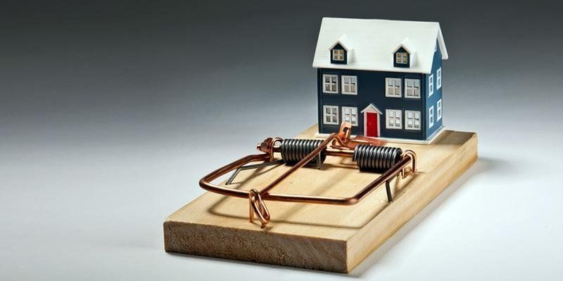 trappola per topi con modellino di una casa