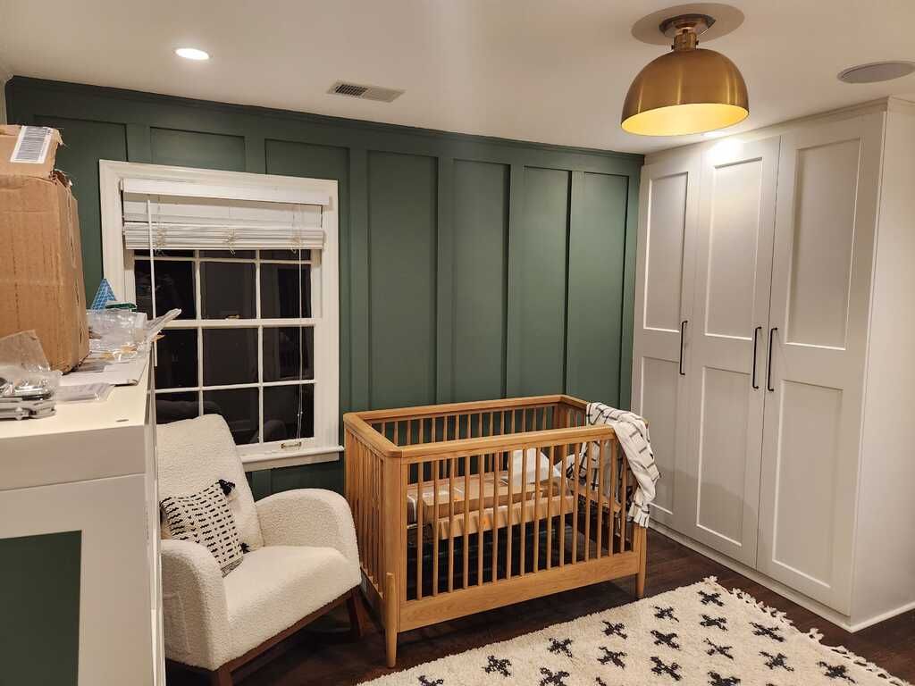 There is a crib in the middle of the room.