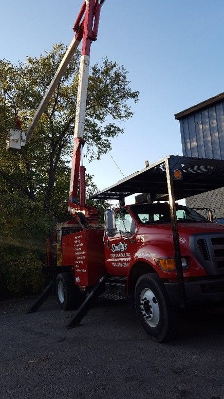 A red truck with a crane on the back