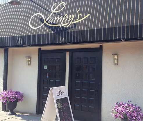 A building with a sign that says lampy 's on it