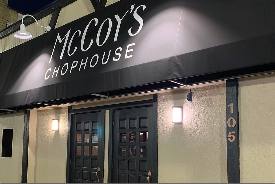 The outside of a restaurant called mccoy 's chophouse