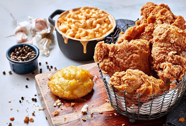 4 piece fried chicken meal with side of macaroni and cheese and cornbread