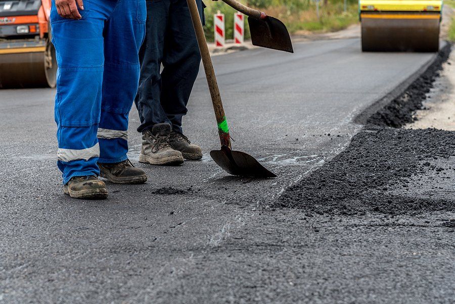 workers doing road asphalt repair
