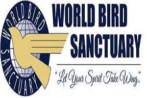 Logo for World Bird Sanctuary: A golden bird silhouette with outstretched wings over a globe, with the words 