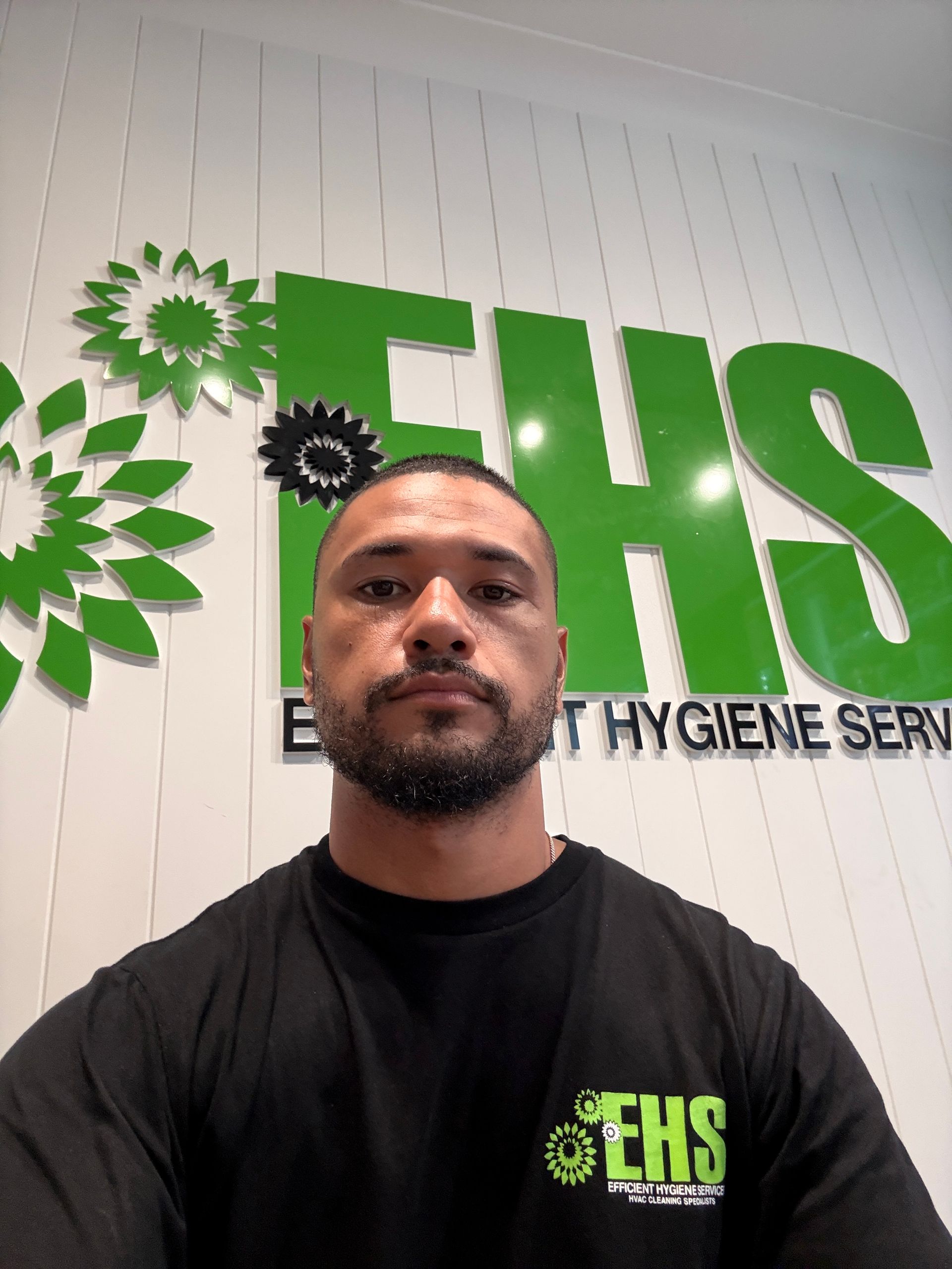 Sean Edwards in  a black shirt with 