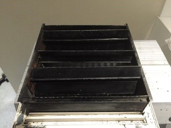 Black louvered air vent, angled view, showing multiple horizontal slats.