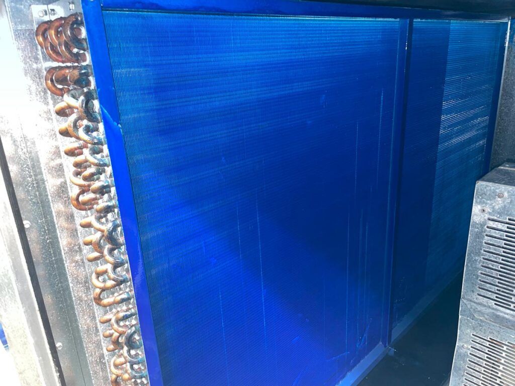 Blue air filter panel in an HVAC system.