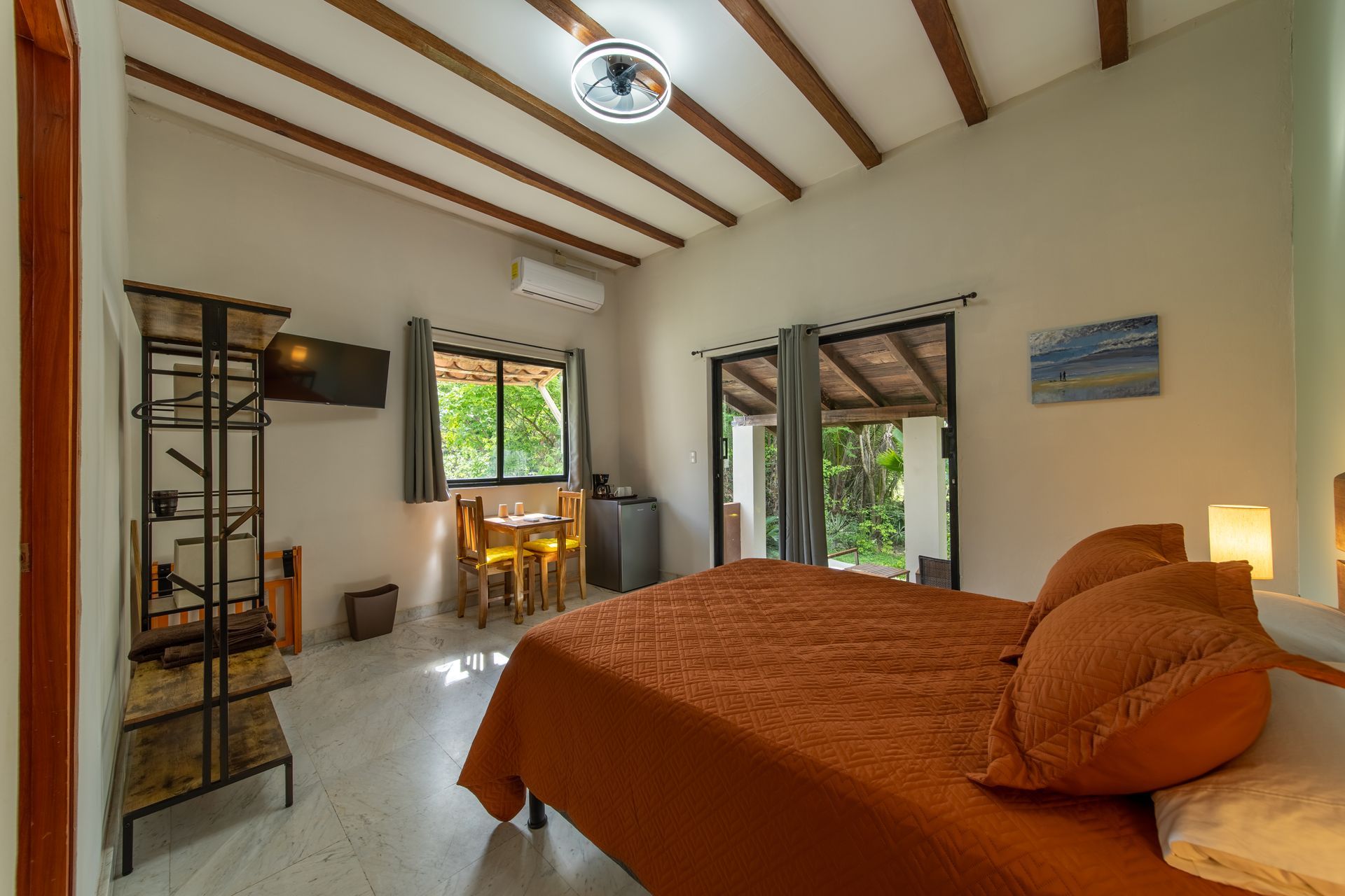 There is a large bed in the middle of the room.