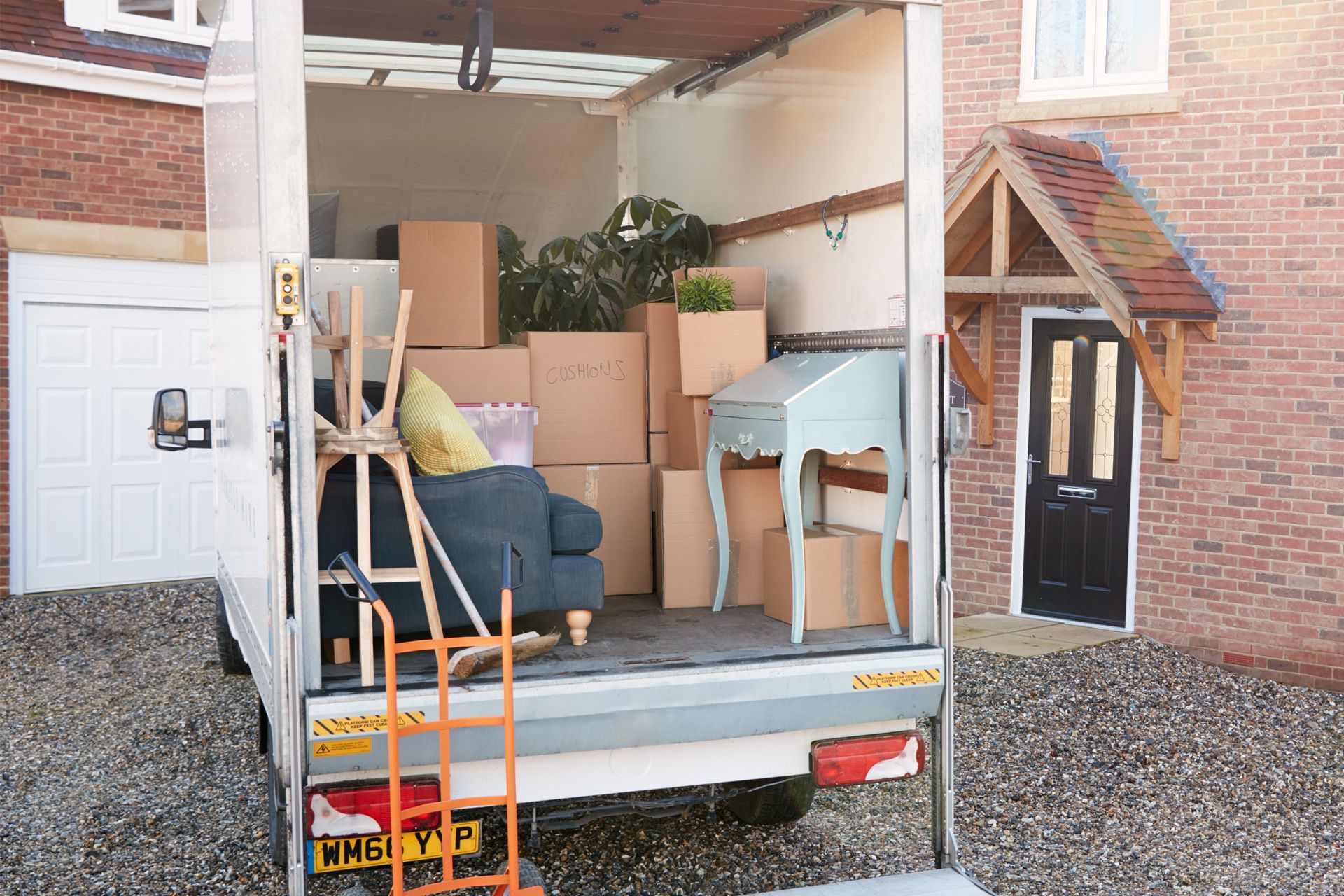 Moving Truck Filled With Furniture and Boxes