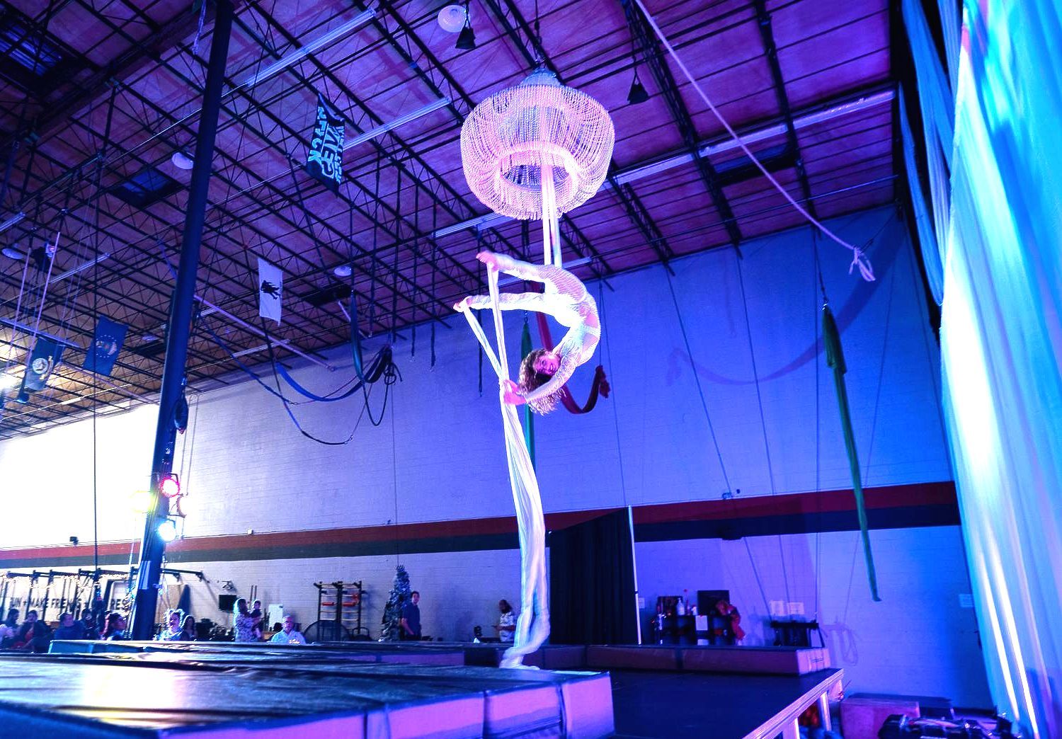 A woman is doing aerial acrobatics