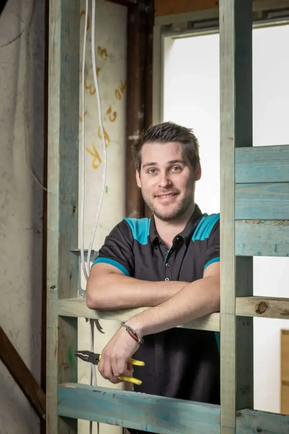 A Man Standing Next to a Wooden Frame — Firefly Connections In Mayfield West, NSW