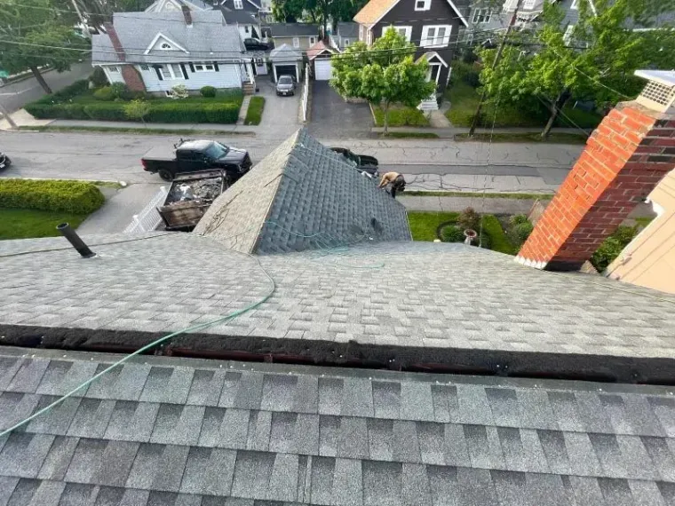 An aerial view of a roof with a hose attached to it.
