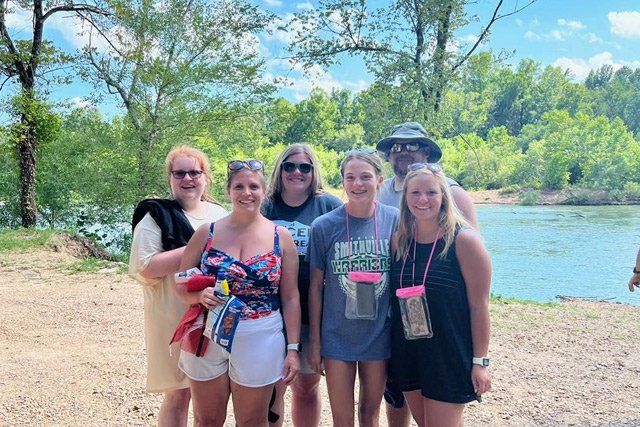 Family in Front of the River — Doniphan, MO — Rocky River Resort