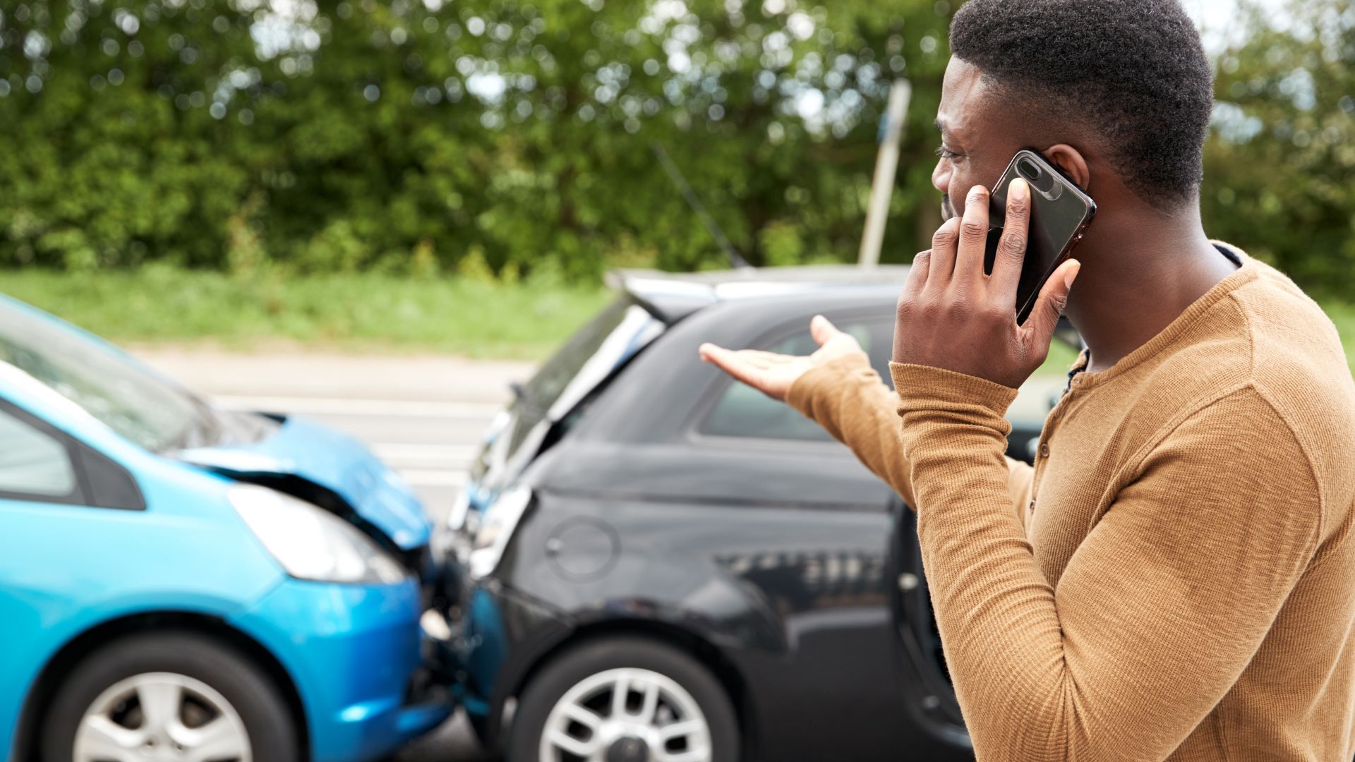 man on the phone after car accident