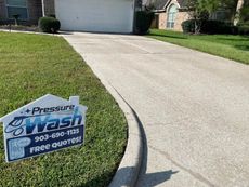 A driveway with a sign that says pressure wash on it.