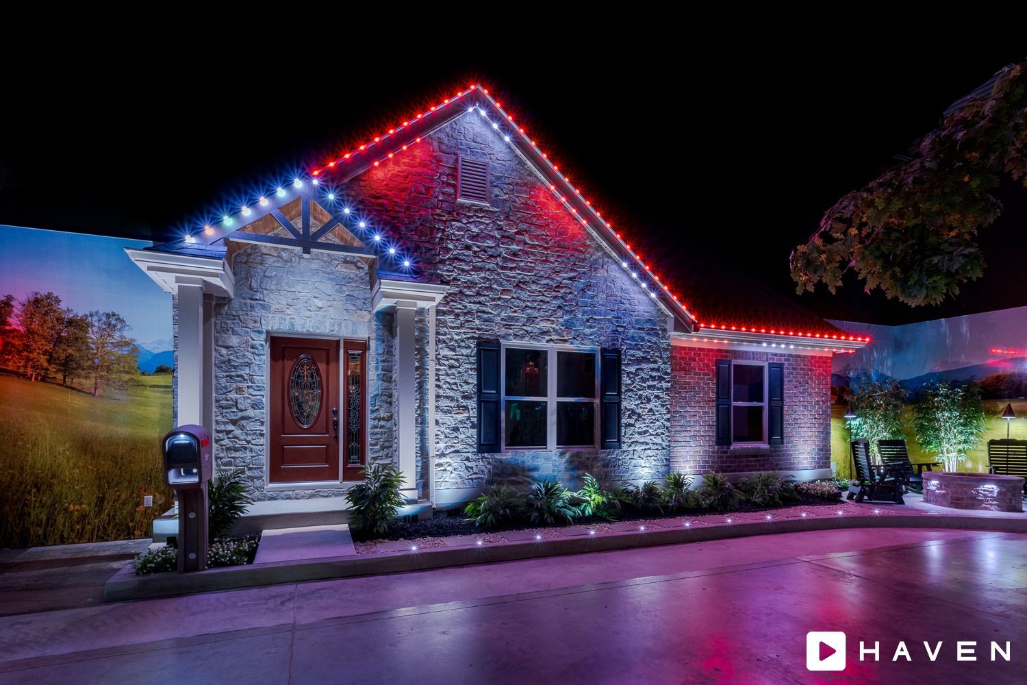 A house with red , white and blue lights on it at night.