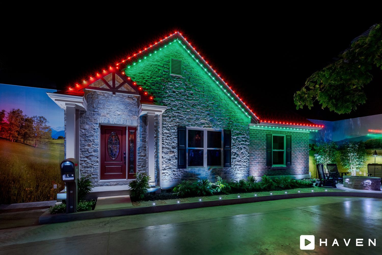 A house with christmas lights on it is lit up at night.