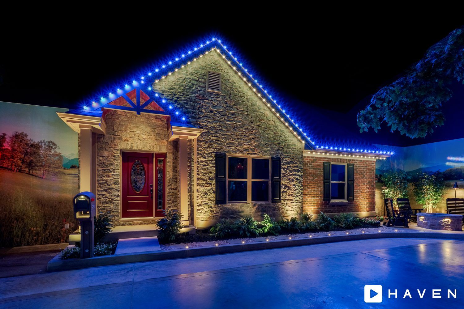A house with christmas lights on it is lit up at night