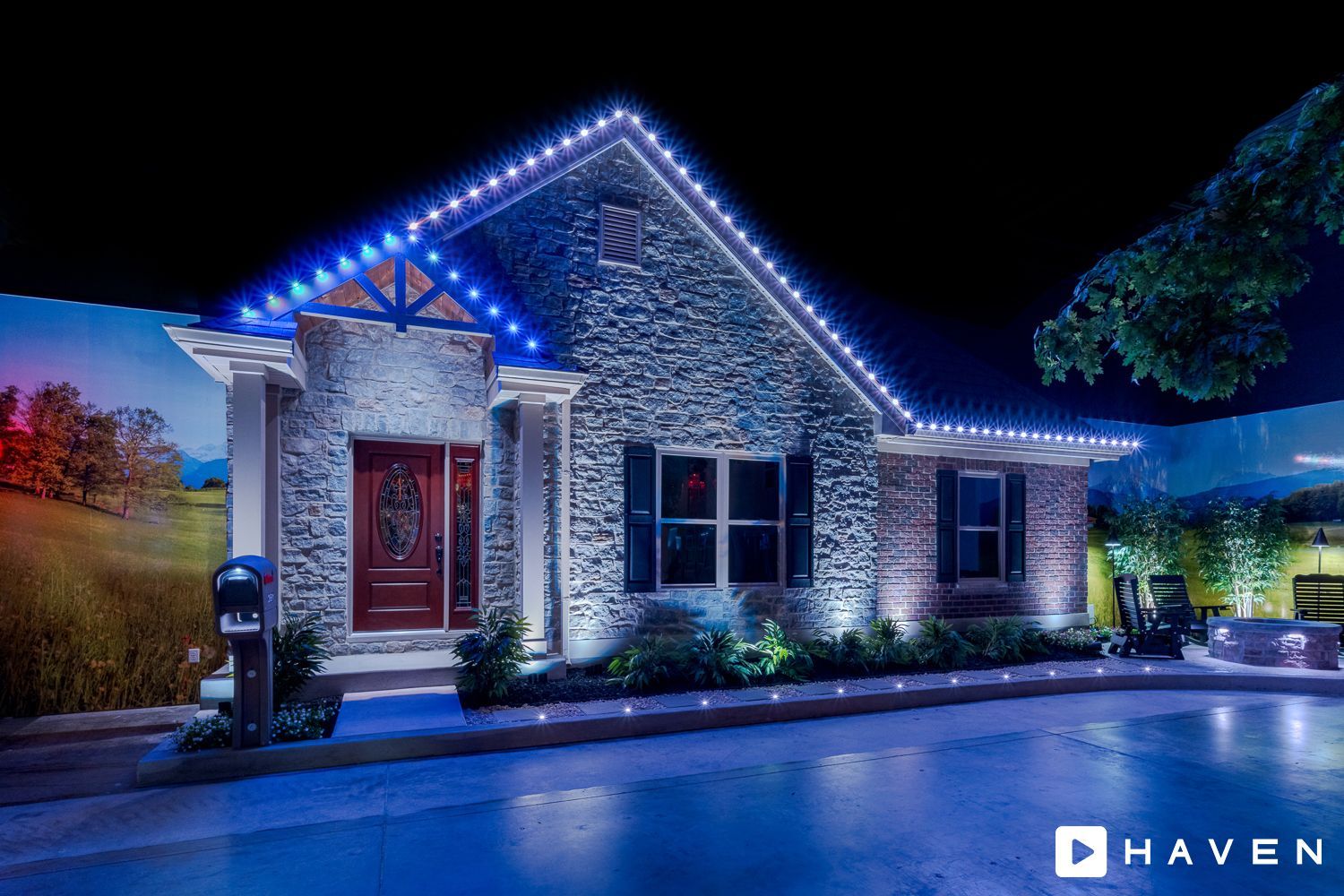 A house is lit up with blue lights at night.