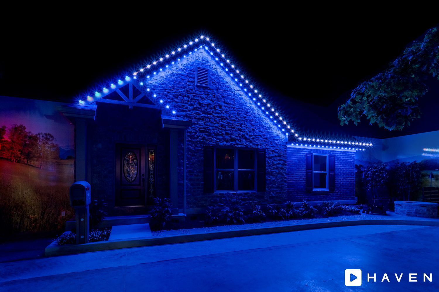A house is lit up with blue lights at night.