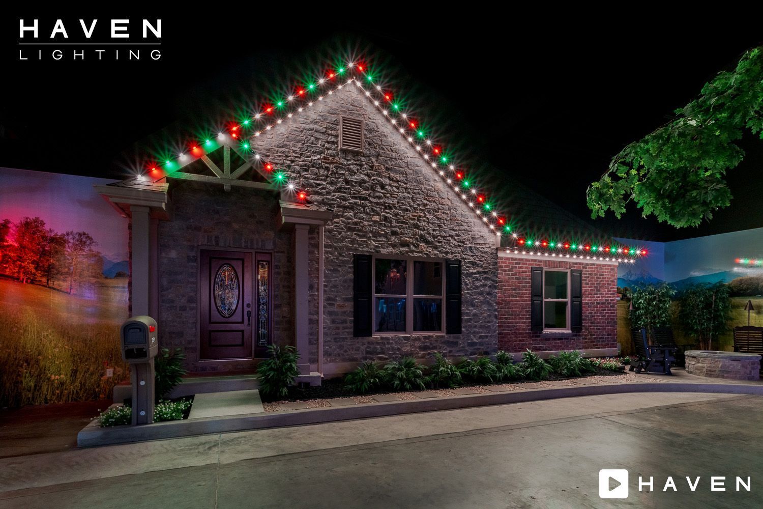A house with christmas lights on the roof is lit up at night.
