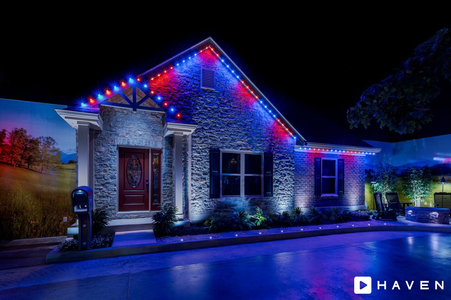 A house with red , white and blue lights on it at night.