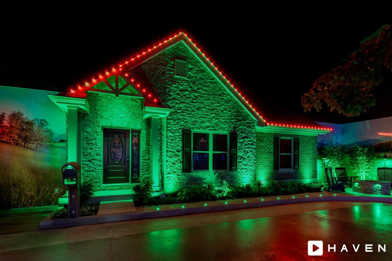 A house with green and red lights on it at night.