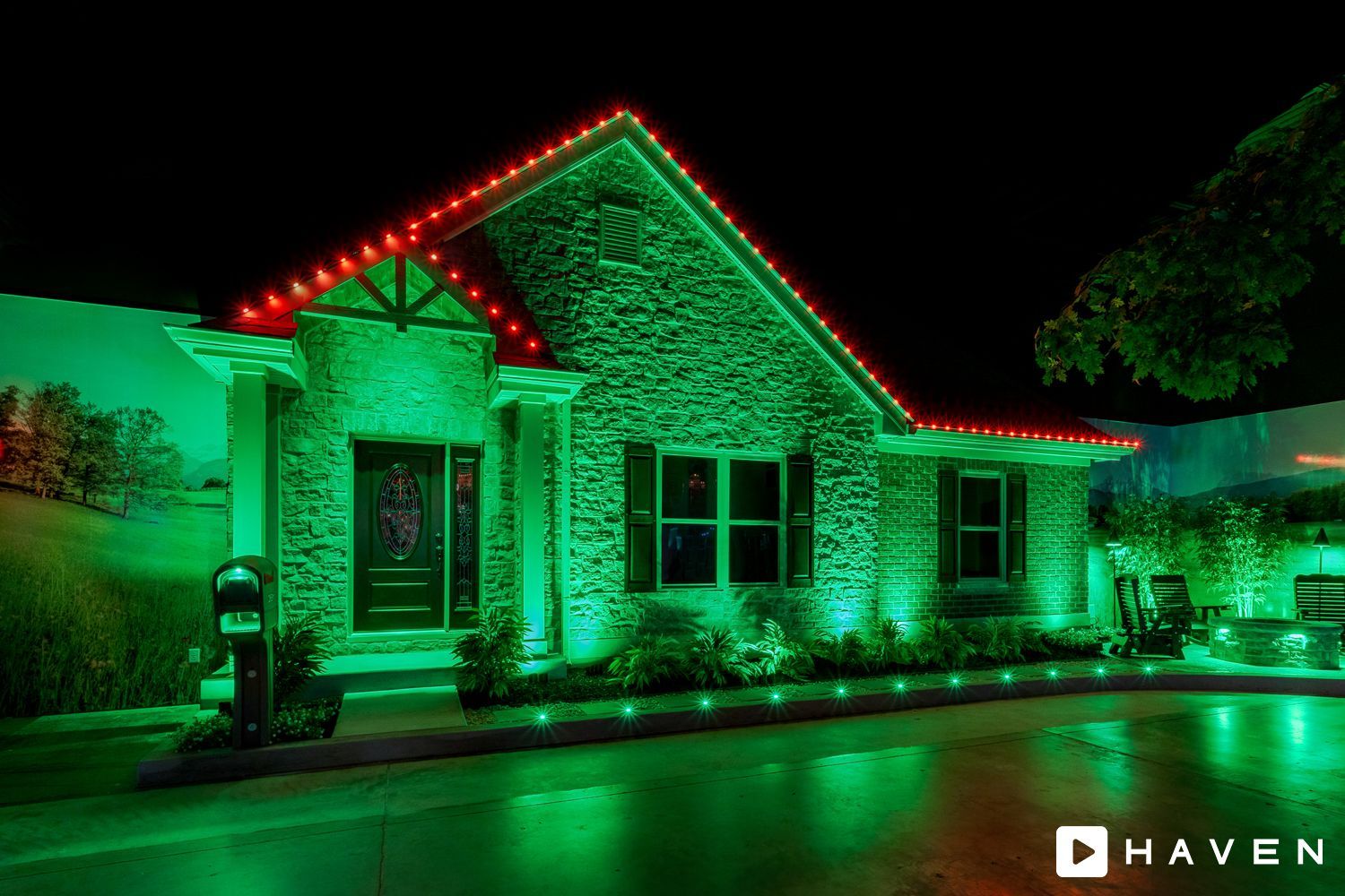A house is lit up with green lights at night.