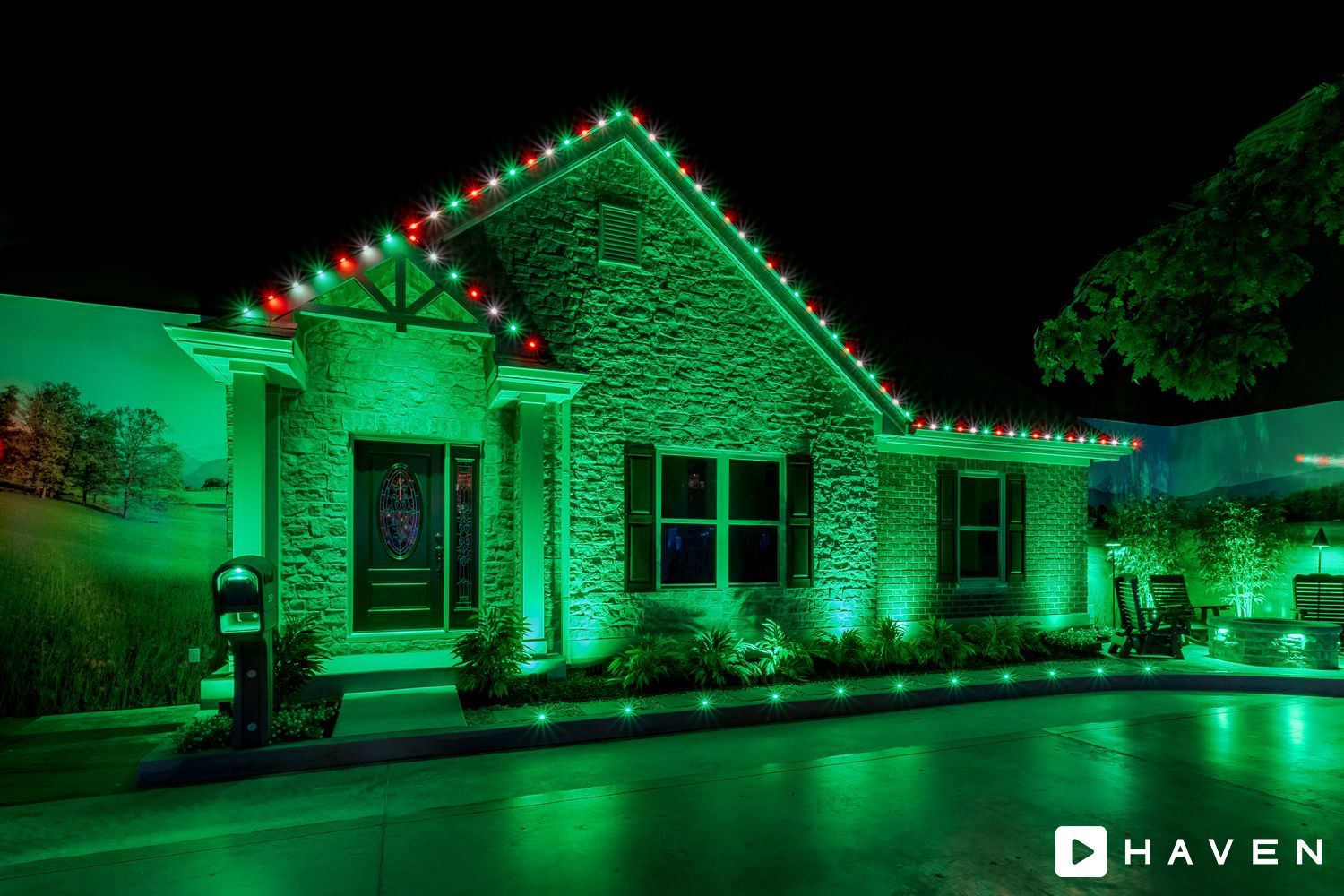 A house is lit up with green and red christmas lights.