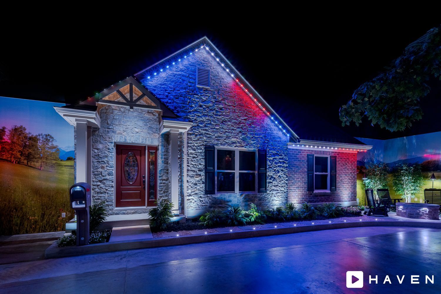 A house is lit up with red , white and blue lights.