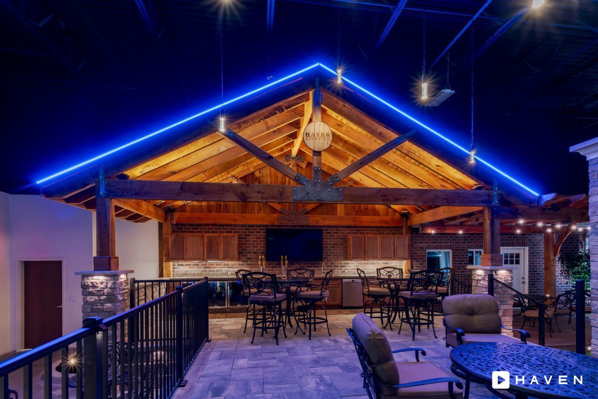 A large room with a blue light hanging from the ceiling.