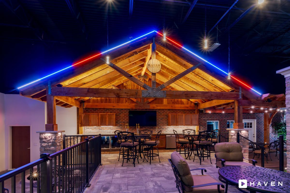 A large room with a roof that has red , white and blue lights on it.