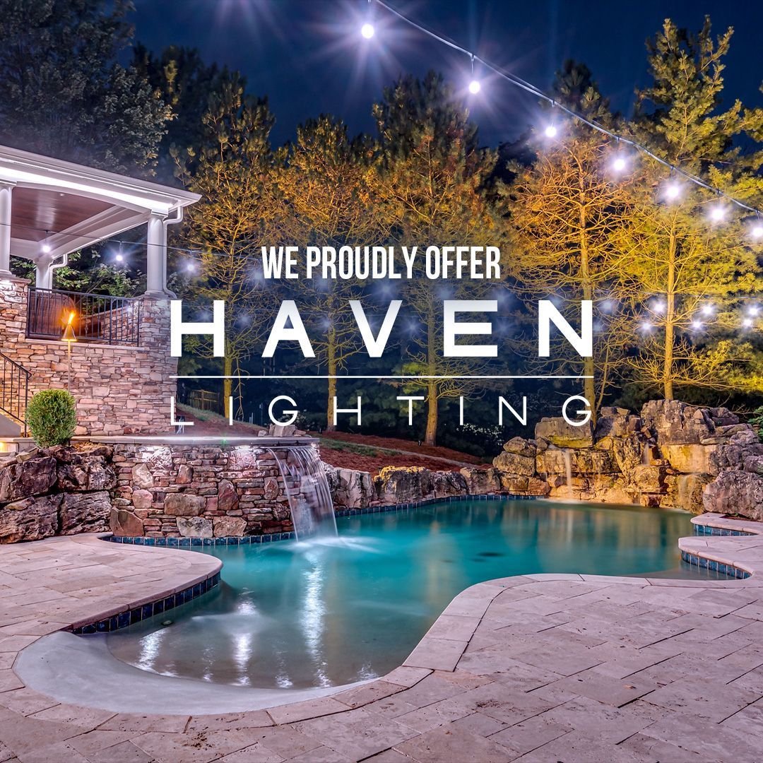 A picture of a swimming pool with a house in the background.