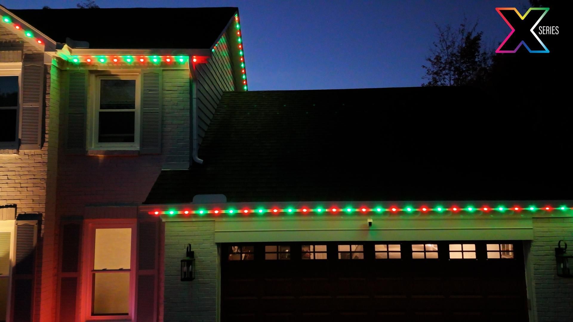 A house with red and green christmas lights on it