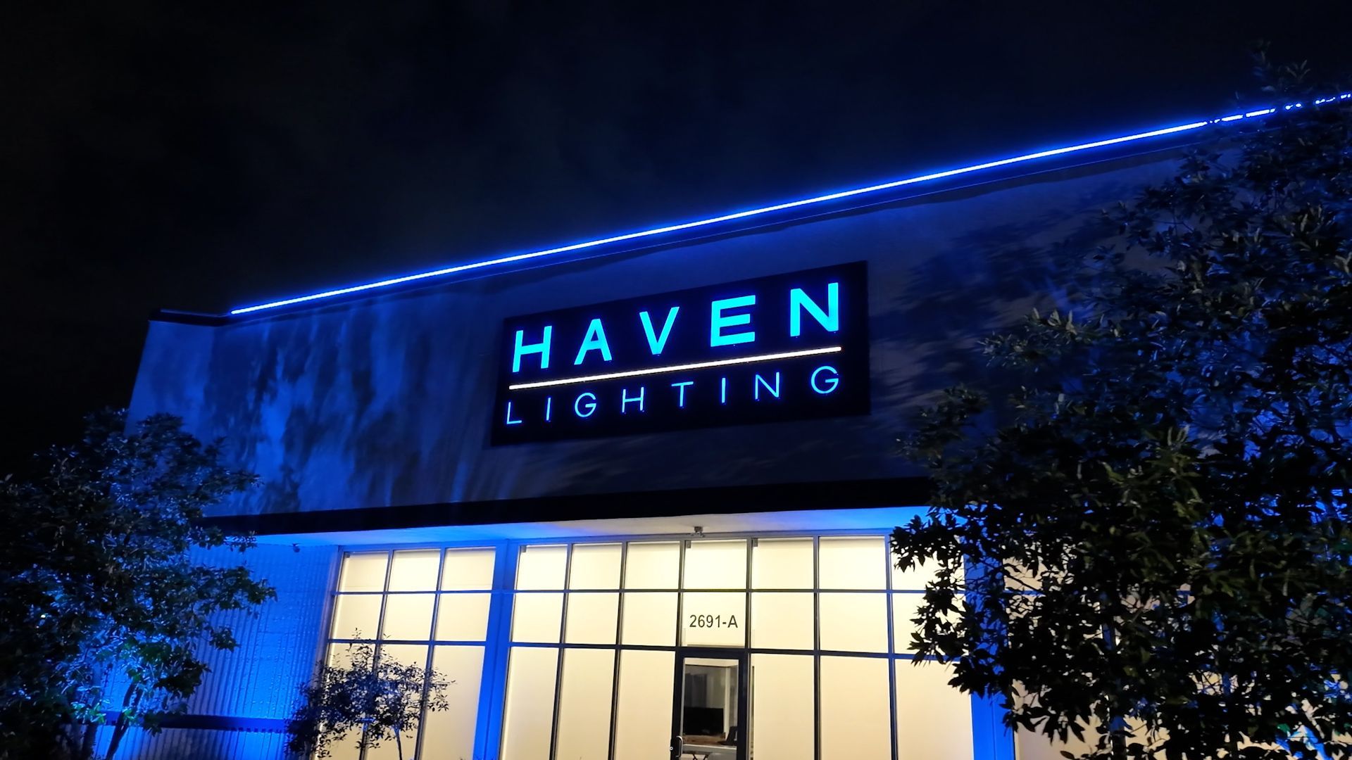 A building with a sign that says haven lighting on it
