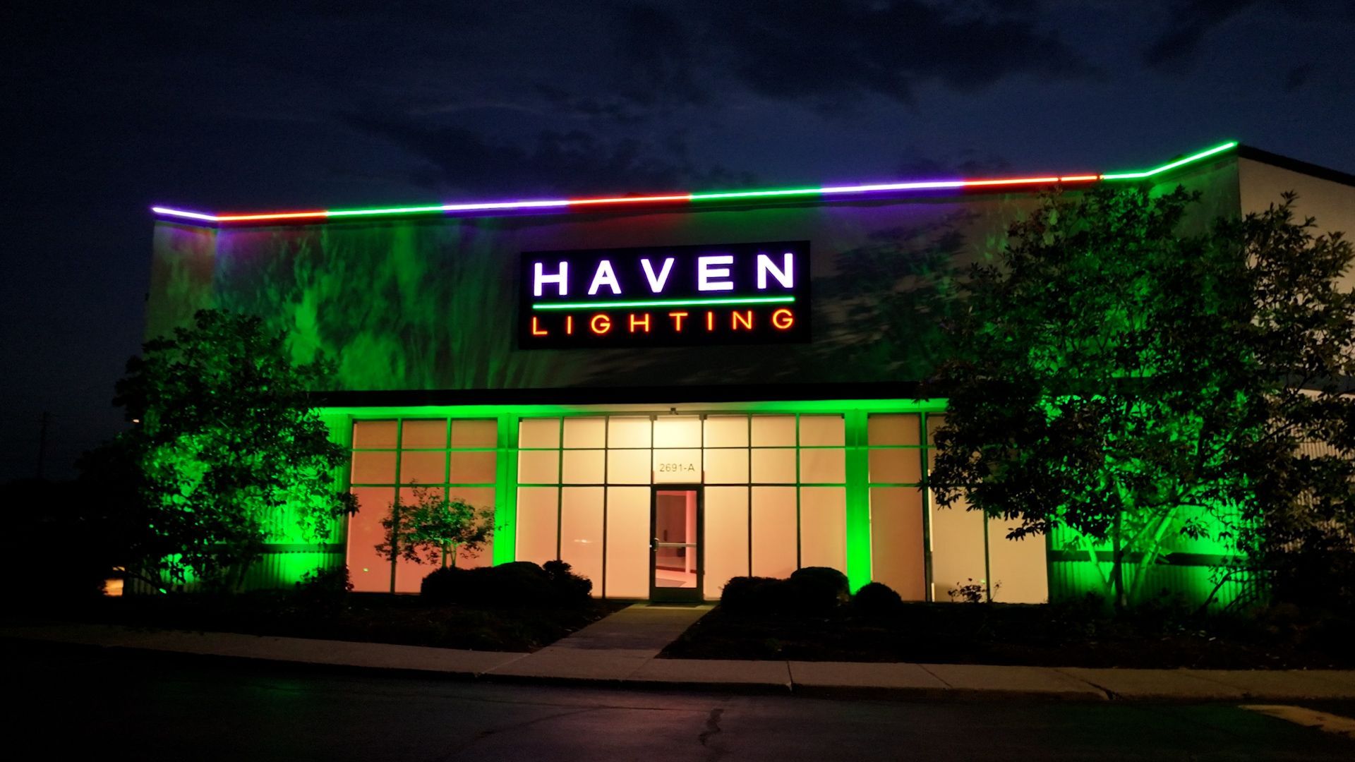 A haven lighting building is lit up at night