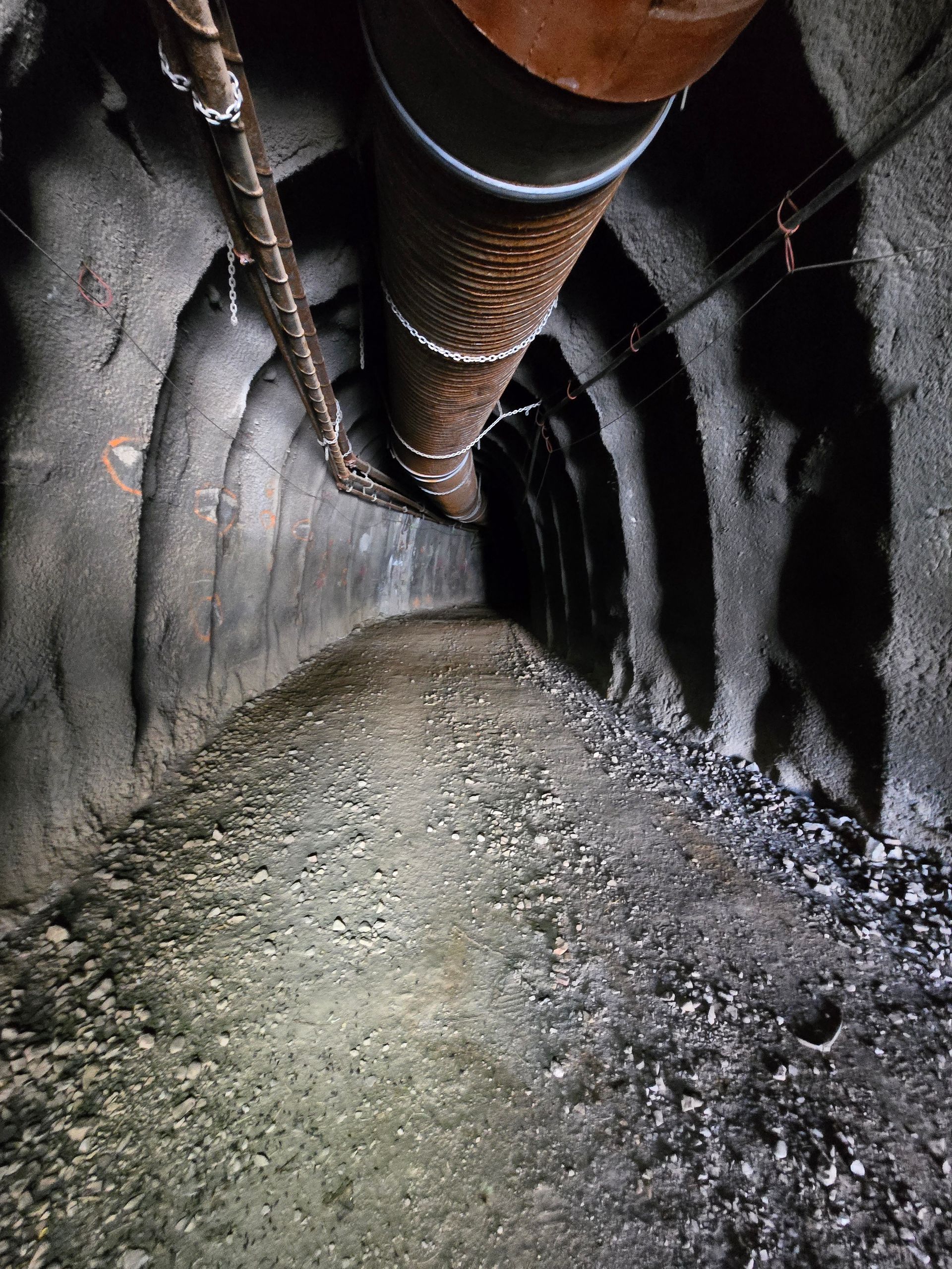A tunnel with a large pipe coming out of it