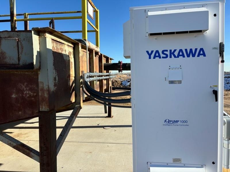A yaskawa box is sitting on a sidewalk