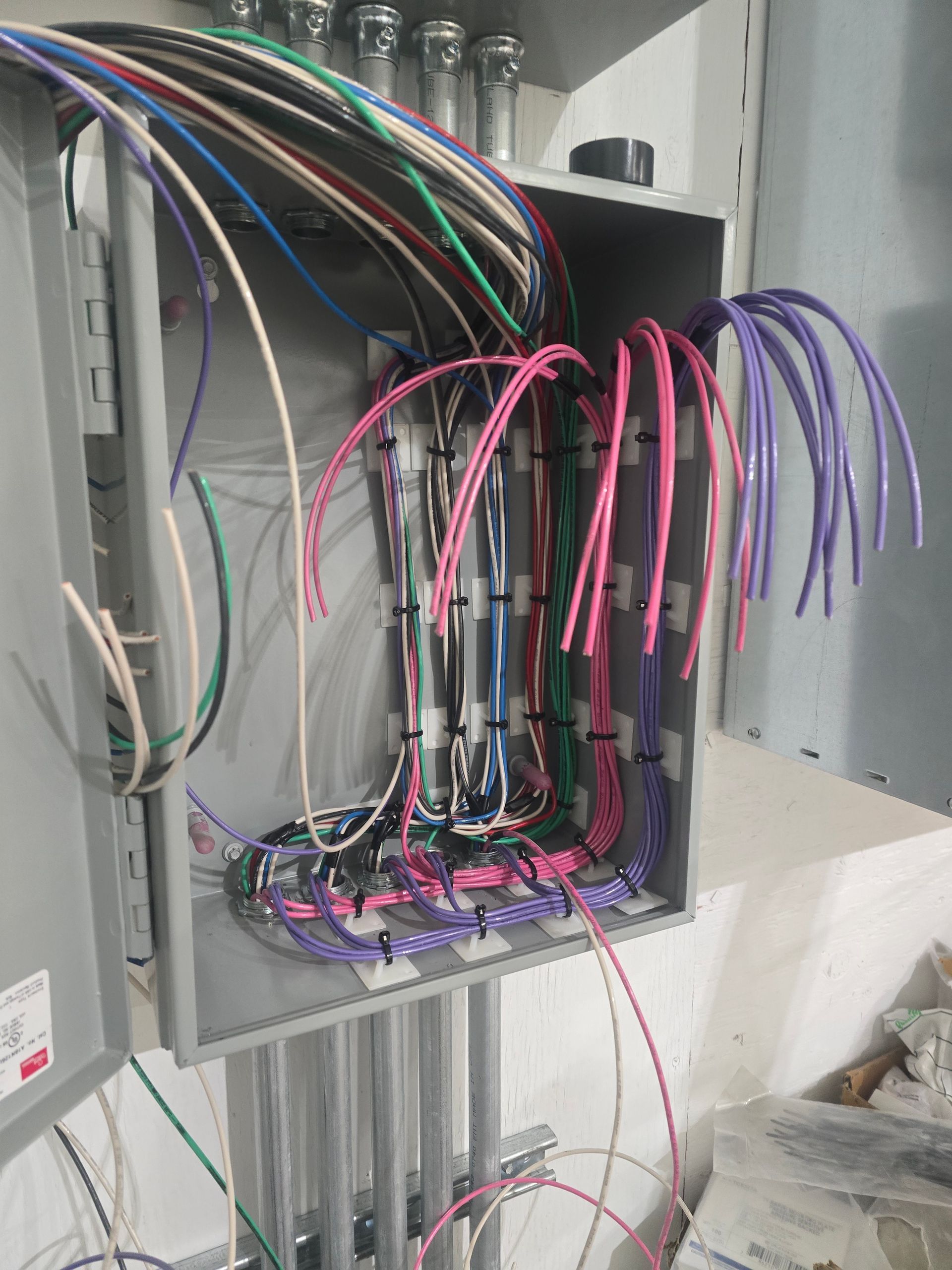 A box filled with lots of wires and cables.