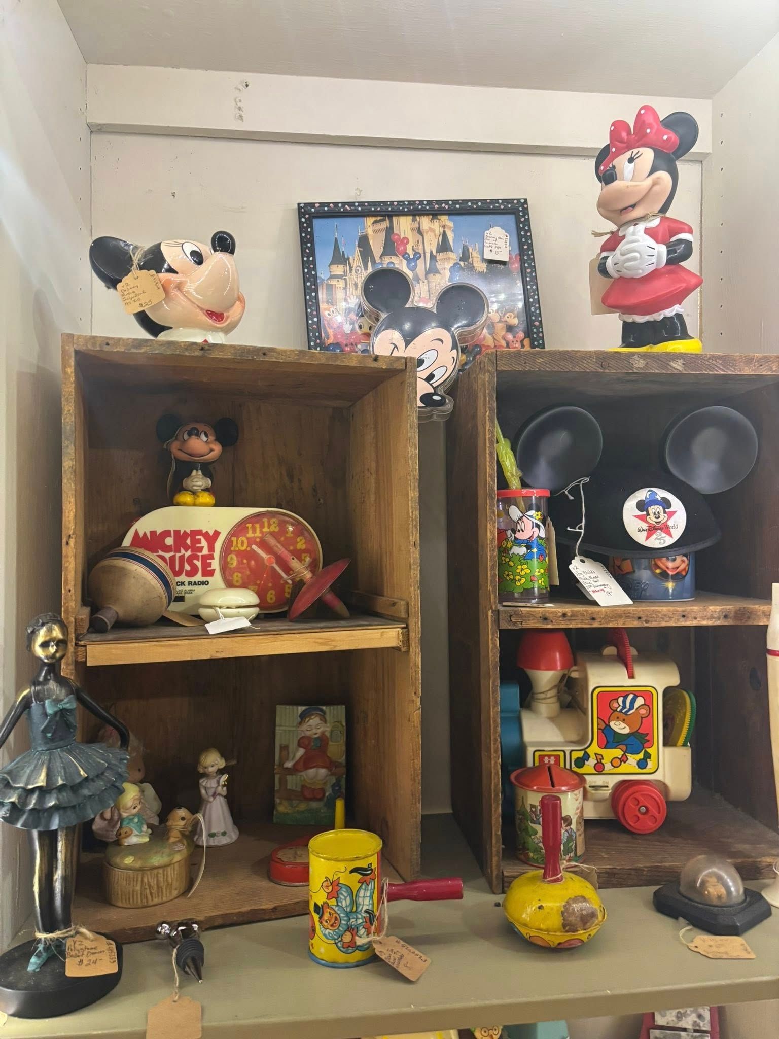  vintage Mickey Mouse collectibles: a bust, figurines, framed art, and toys.