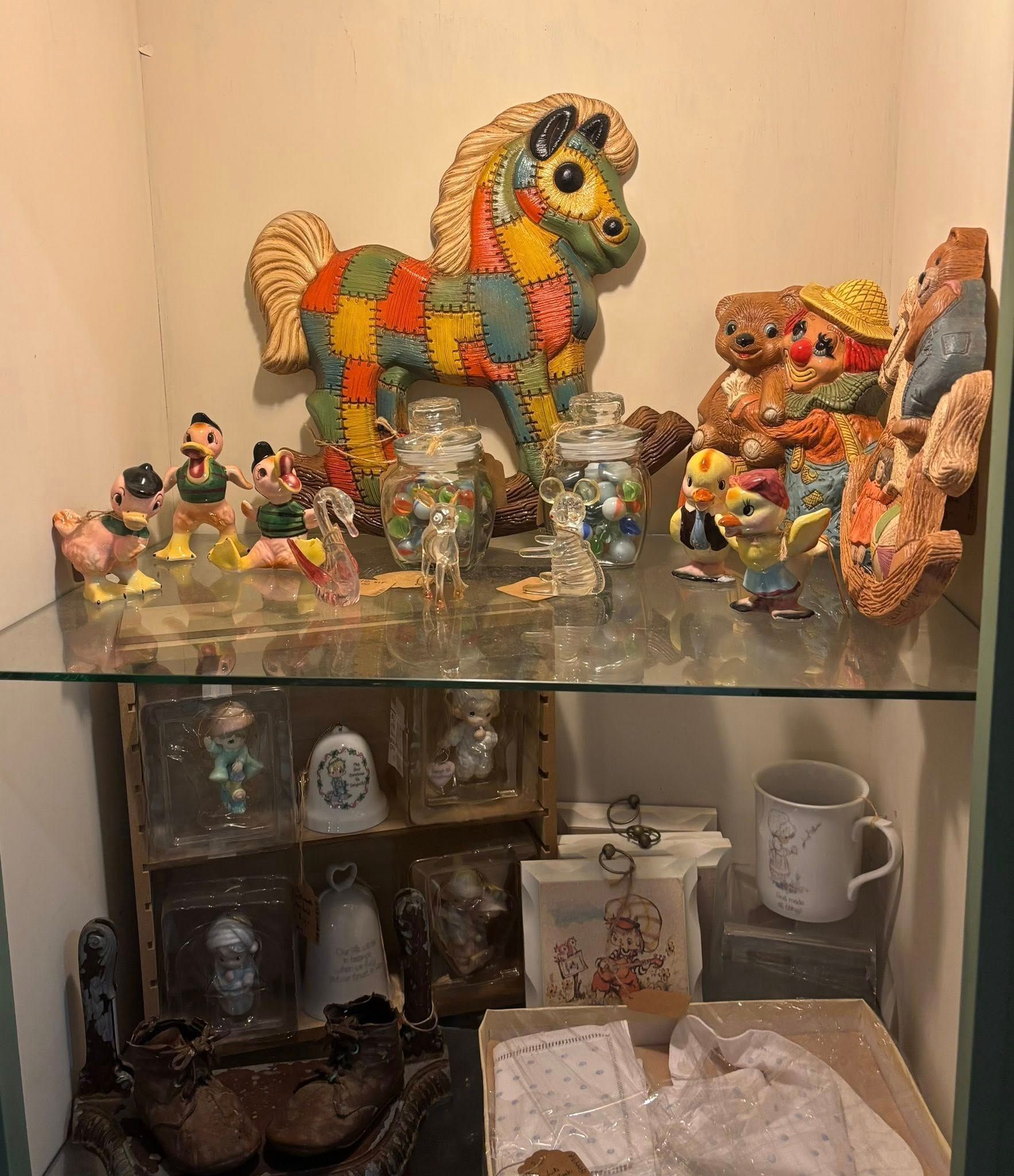 colorful folk art horse, figurines, and other collectibles.