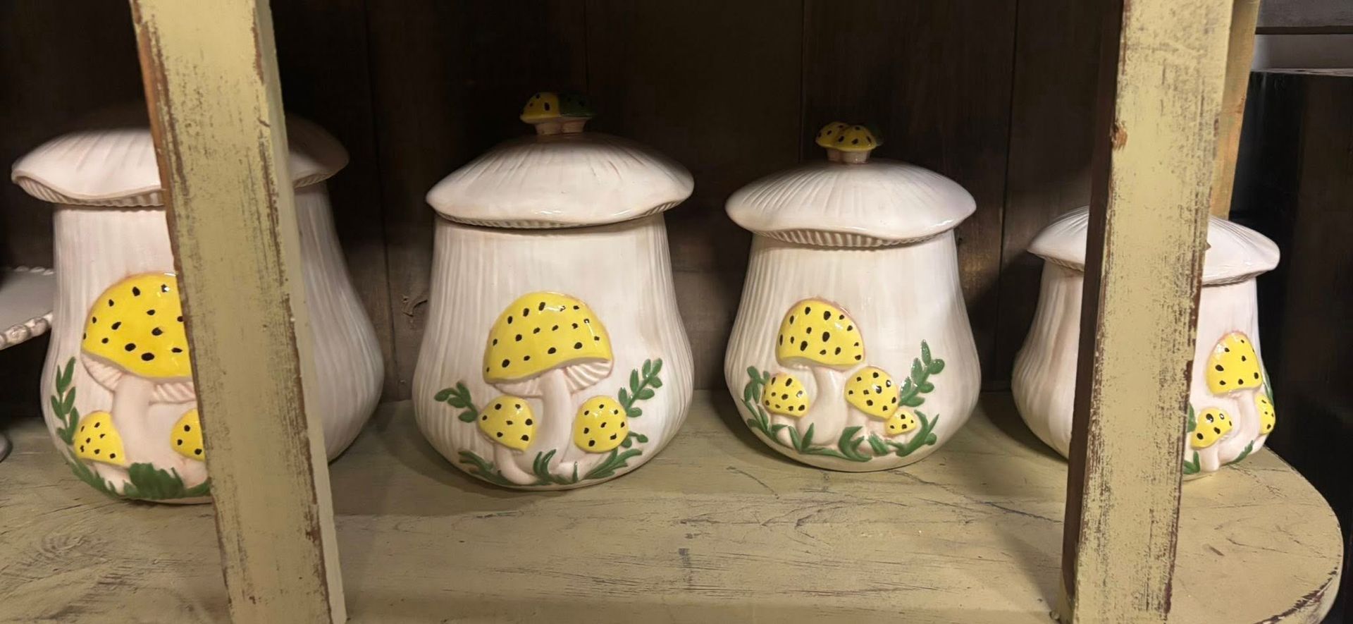 Ceramic mushroom-shaped canisters in white with yellow spots